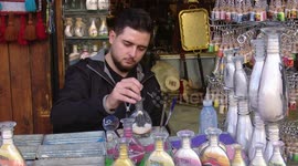 Sand bottle artist in Jordan expresses hope for peace in Gaza