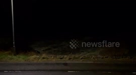 Waves crashing upto the road on Loch Long in Argyll Scotland