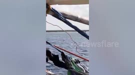 Chinese coast guards on motorboats chase away Filipino fishermen in South China Sea