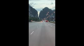 Sparks fly as carjacked pickup truck races across highway in Thailand