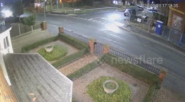 Driver narrowly escapes being hit by roof that flew off property