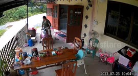 Father topples over with motorcycle while reversing off front porch