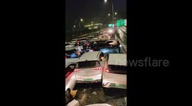Massive pile-up including more than 60 vehicles on eastern China's overpass, amid rainy and snowy weather