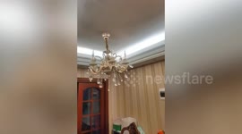 Chandeliers swing like pendulums during strong China earthquake