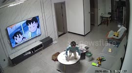 Child destroys TV screen by hitting it with toy truck