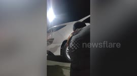 Stray cat stuck in wheel of parked car rescued