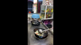 The Street Chef demonstrate cooking skills with fire