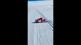 Woman Does Yoga Headstand While Wearing Skis