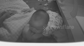 Baby persistently sleeping on mother’s head at night in China