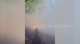 Hiker captures glowing halo around shadow on sacred mountain