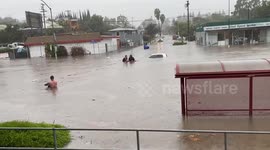 Lifeguards rescue truck driver stranded in California floods