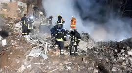 Rescue teams remove bodies from building destroyed by Russian strikes on Kharkiv