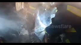 Child's body recovered from rubble following Russian strikes on Kharkiv