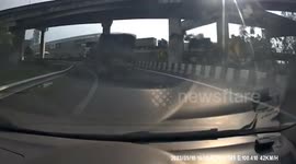 Large bags of materials fall from back of delivery truck on bridge