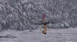 Drone and robot team up to clear ice from power lines amid heavy snowfall in southern China