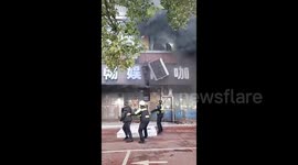 People jump from burning building in China to escape deadly fire