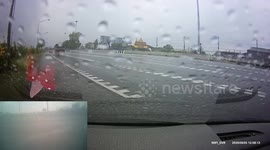 Truck Causes Close Call on Rainy Road