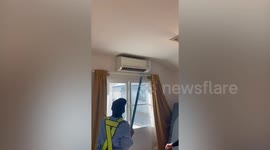 Snake leaps out of aircon and hides under bed