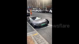 Car gets trapped in sinkhole opened up on Chinese road