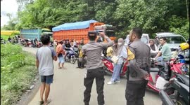 Police urge motorists to turn around because there is a landslide on the main road leading to Bone district, Indonesia