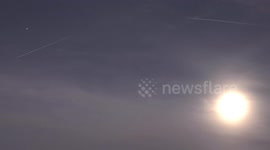 ISS the International Space Station spotted near the rising Full Moon in the swiss Alps