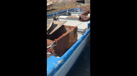 Fisherman shows variety of fish caught while deep sea fishing in the Indian Ocean