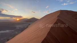 On top of the tallest sand dunes in the world in Namibia for sunrise