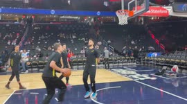 High-Fiving Washington Wizards National Basketball Association Players and Utah Jazz players shooting baskets
