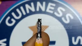 World record holder crafts sculpture of Hindu god Ram smaller than their fingernail