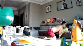 Quick-thinking father catches daughter falling off sofa in China