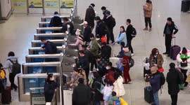 Passengers enter the platform after checking in tickets in Xuzhou, China