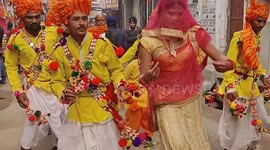 Devotees gathered in northern India to celebrate the procession of Lord Beni Madhav with musical instruments