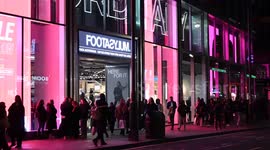 Cycling past Footasylum in Oxford Street, London, United Kingdom