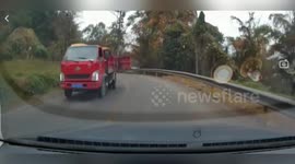 Truck's loose cargo door slams into oncoming car