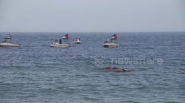 Boats with Palestinian Flags on Table Bay, Activist stage protest in support of Palestine on world famous beach