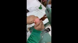 Doll Maker Sews On Hair