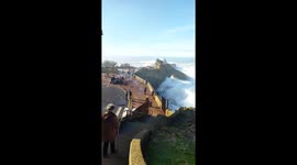 Locals slammed to ground by huge wave catapulting over seawall in France