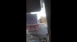 Wild elephant stops passing trucks for food