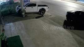 Out-of-control truck skids through tiny gap... avoiding two parked cars