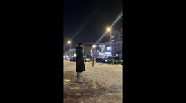 Couple's sweet hugging video fails when girlfriend slips on snow