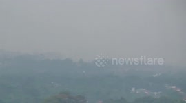 Heavy rain in another city extends closer to us in the foothills, captured in time-lapse until evening skies clear