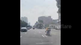 Delivery man brings his dog along with him for the ride in Zhejiang, China