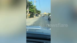 Ghost wheel bounces along road in Thailand