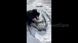 Talented Chinese man carves stunning giant dragon on frozen river