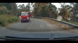 Truck trailer's back door slams car, shattering front windscreen in China
