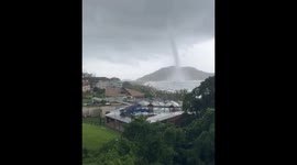 Dual waterspouts descend: Santinho, Brazil