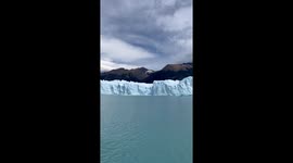 Sightseers Watch Iceberg Emerge From the Perito Moreno Glacier