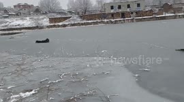 Two girls trapped in icy lake rescued in Ukraine