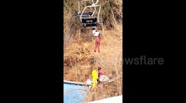 Teenage girl saved after hanging from ski lift in China