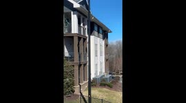 Creative exodus: Neighbors' ingenious and amusing move from third-floor apartment